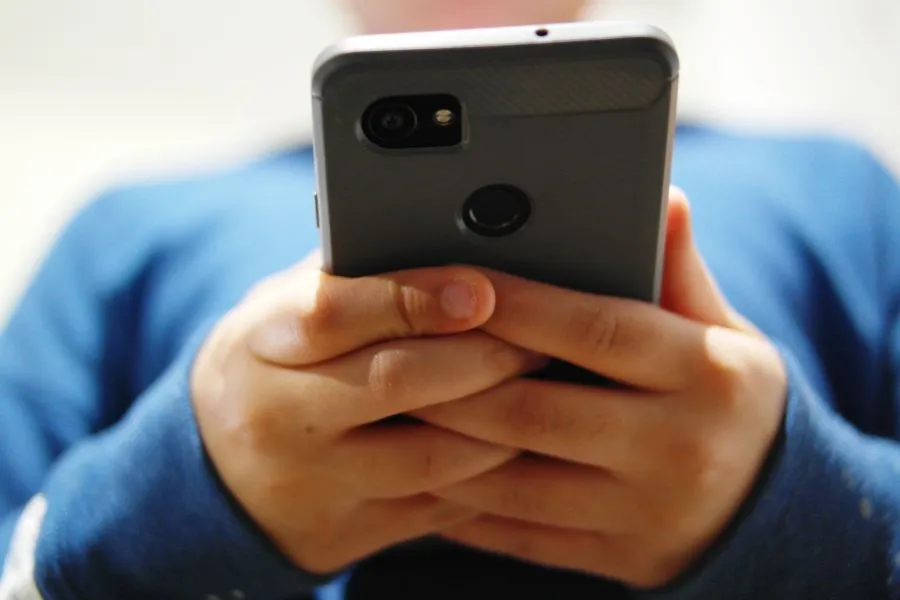 teenager scrolling on tiktok